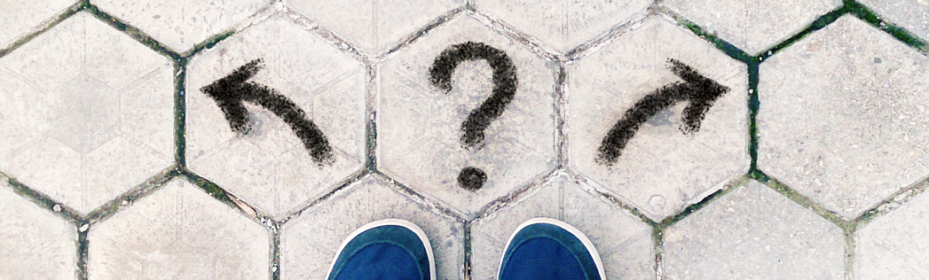Left arrow and right arrow on sidewalk